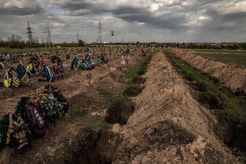 Dozens of freshly-dug graves lie next to the more than 400 graves of Ukrainian soldiers killed since Russia’s invasion began, at Krasnopolski Military Cemetery in the eastern city of Dnipro, Ukraine.