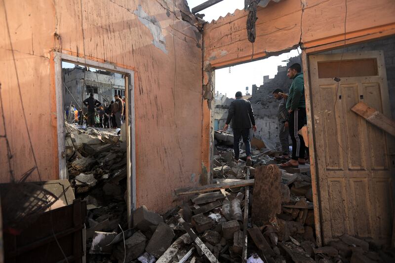 A destroyed building in Khan Younis. Photograph: Yousef Masoud/The New York Times
                      
