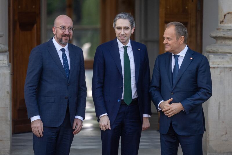 Taoiseach Simon Harris with European Council president Charles Michel (left) and Polish prime minister Donald Tusk in front of the Palace on the Isle (Lazienki) in Warsaw, Poland, on Thursday, as Poland hosted a meeting of European leaders. Photograph: Wojtek Radwanski/AFP/Getty