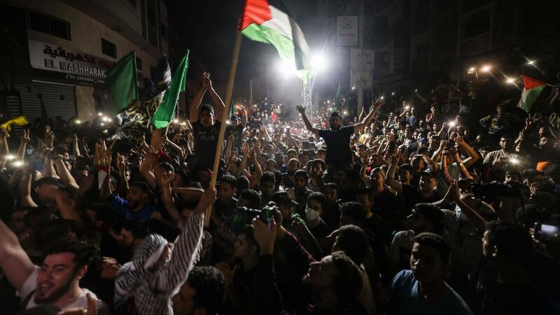 People take to the streets to celebrate following a ceasefire brokered by Egypt between Israel and Hamas, Gaza City early on May 21st, 2021. Photograph: Mohammed Abed/ AFP via Getty Images