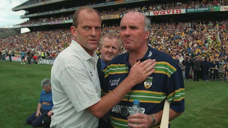 Clare manager Ger Loughnane with  his Offaly counterpart  Michael Bond at the end of the match. Photograph: James Meehan/Inpho