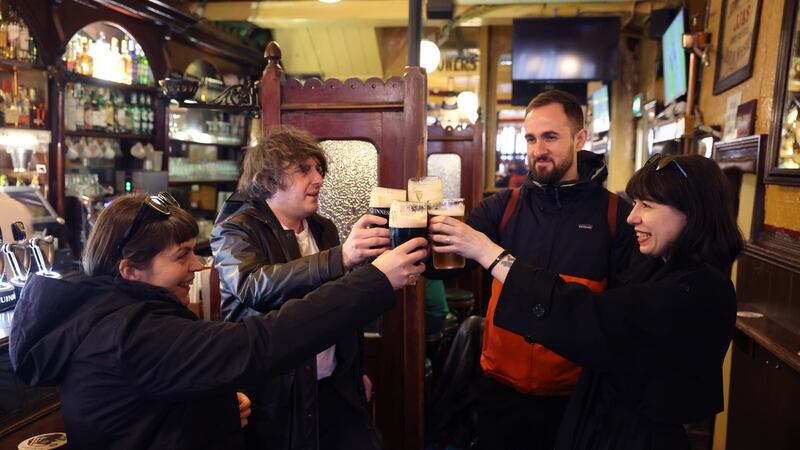 Sarah Bryan, Benjamin Ward, Luke Scott and Helen Collett, visiting from Manchester, enjoy a drink as singer Paul Heaton put some money behind the bar at Kehoes, on South Anne Street, in Dublin to mark his 60th birthday. Photograph: Dara Mac Dónaill / The Irish Times