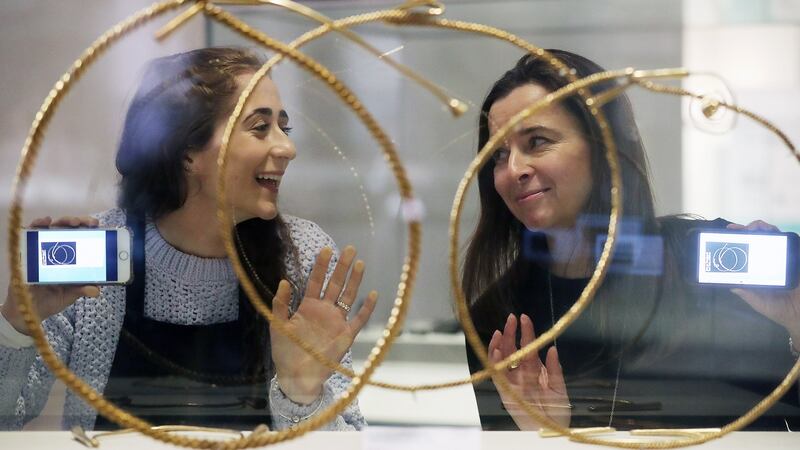 Transition year student Grainne Mongey from Loreto Balbriggan with Tara Clarke from Zinc Design beside the Tara torcs from 1200 BC
