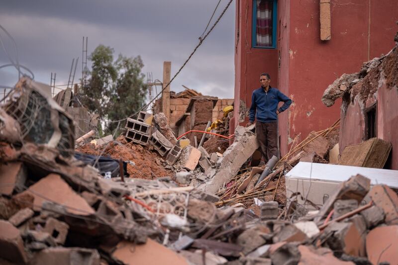 A resident stands among the ruins of a collapsed building in Ouirgane. Photographer: Nathan Laine/Bloomberg