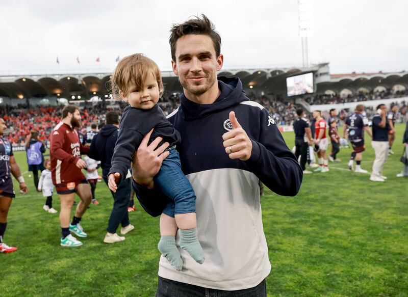 Former Munster and current Bordeaux player Joey Carbery with his son Beau after the game. Photograph: Dan Sheridan/Inpho