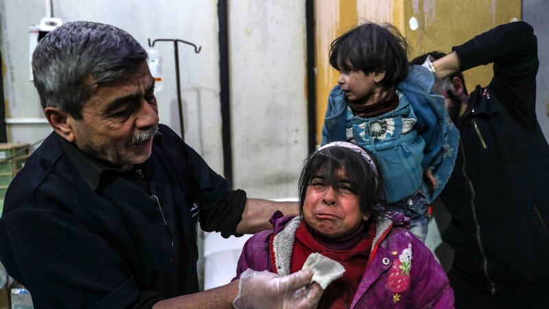 Injured children receive medical attention inside a hospital in  Douma, Ghouta, Syria. Photograph: Mohammed Badra/EPA