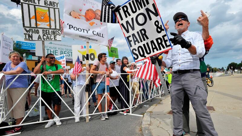 Anti-Trump protesters and supporters of the  US president  outside his rally in Manchester, New Hampshire, on Thursday. Photograph: Joseph Prezioso/AFP/Getty Images