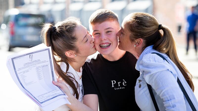 Jackie Carroll (on right) with her daughter Chloe Carroll (centre) and  her friend Louise Aspatariteil (left) after Chloe collected  her Leaving Cert results at Mount Carmel Secondary School in Dublin. Photograph: Tom Honan/The Irish Times.