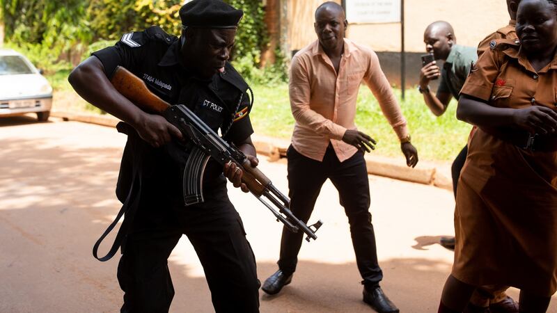 Police fire live rounds outside the courtroom in Kampala where  Stella Nyanzi had her conviction overturned. Photograph: Luke Dray/Getty Images