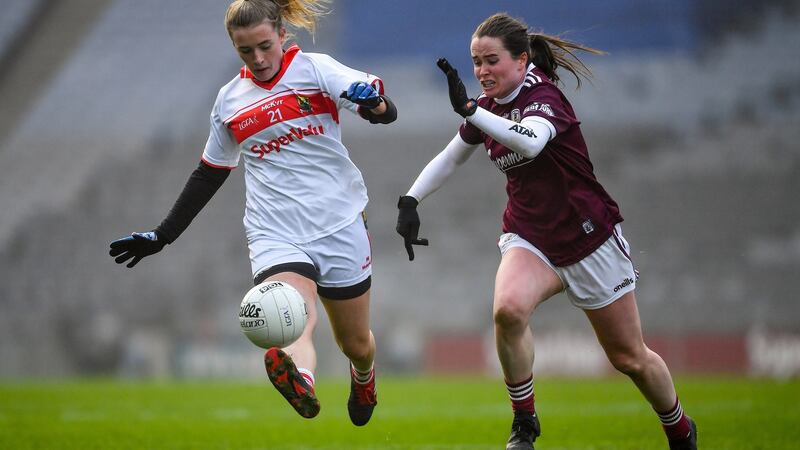 Cork’s Daire Kiely solos away from  Nicola Ward of Galway during the semi-final at Croke Park. Photograph: Ray McManus/Sportsfile