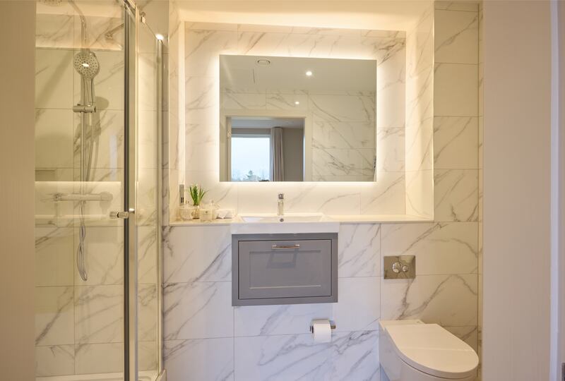 Bathrooms are designed by Helen Turkington and feature lots of marble