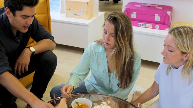 The product team at Propercorn, Tom McKelvey, Olive DelBalzo and Kitty Wright, working on bringing the company’s new flavour to market