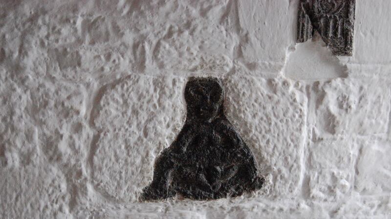 A carving of a Sheela na Gig at Bunratty Castle, Co Clare