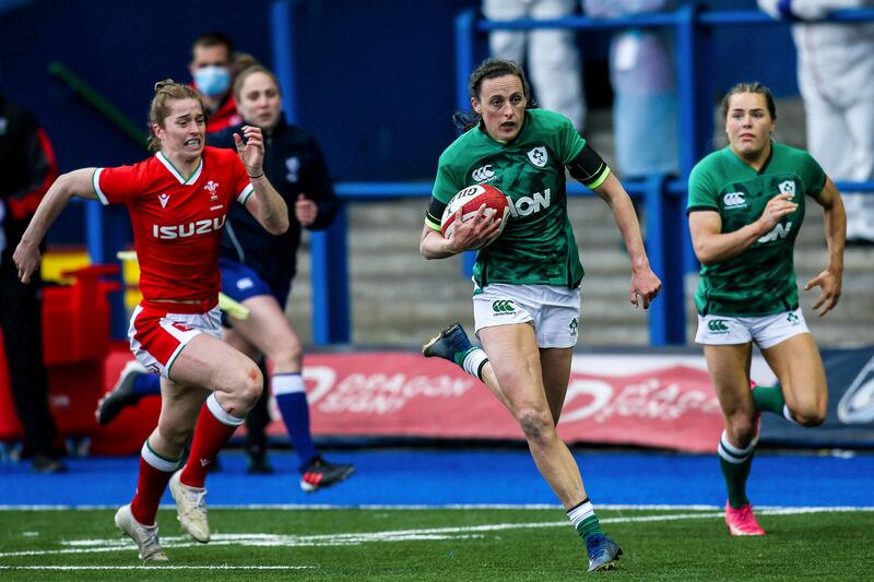 Hannah Tyrrell breaks away to score a try for Ireland in a Women's Six Nations game against Wales at Cardiff Arms Park in 2021. Ireland won 45-0. Photograph: Robbie Stephenson/Inpho