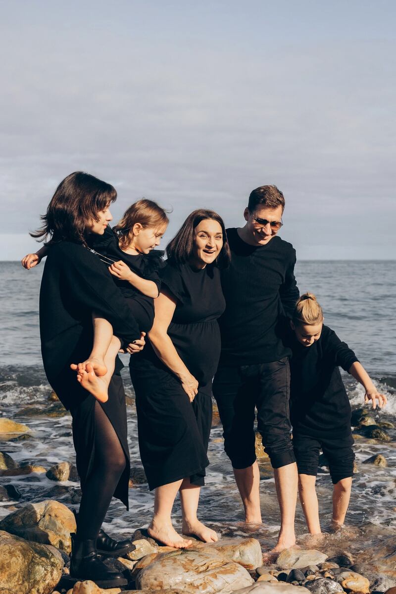 Nataliia Yakymchenko with her husband and three children.