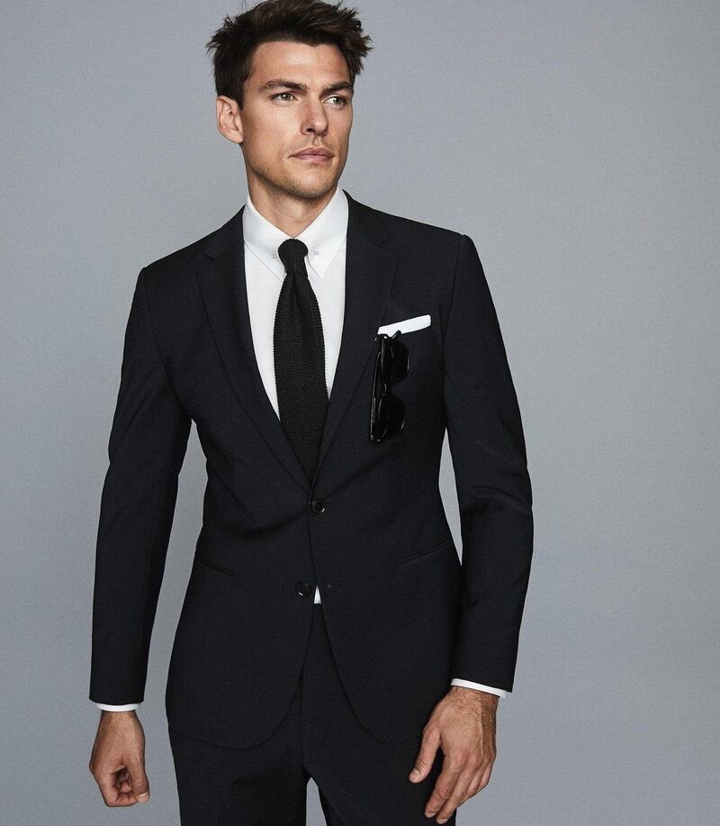 Black blazer, €360, trousers, €165, Reiss