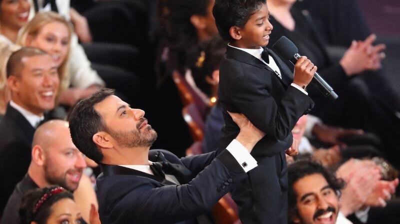Oscars awards show host Jimmy Kimmel lifts Sunny Pawar during the ceremony. Photograph: Reuters