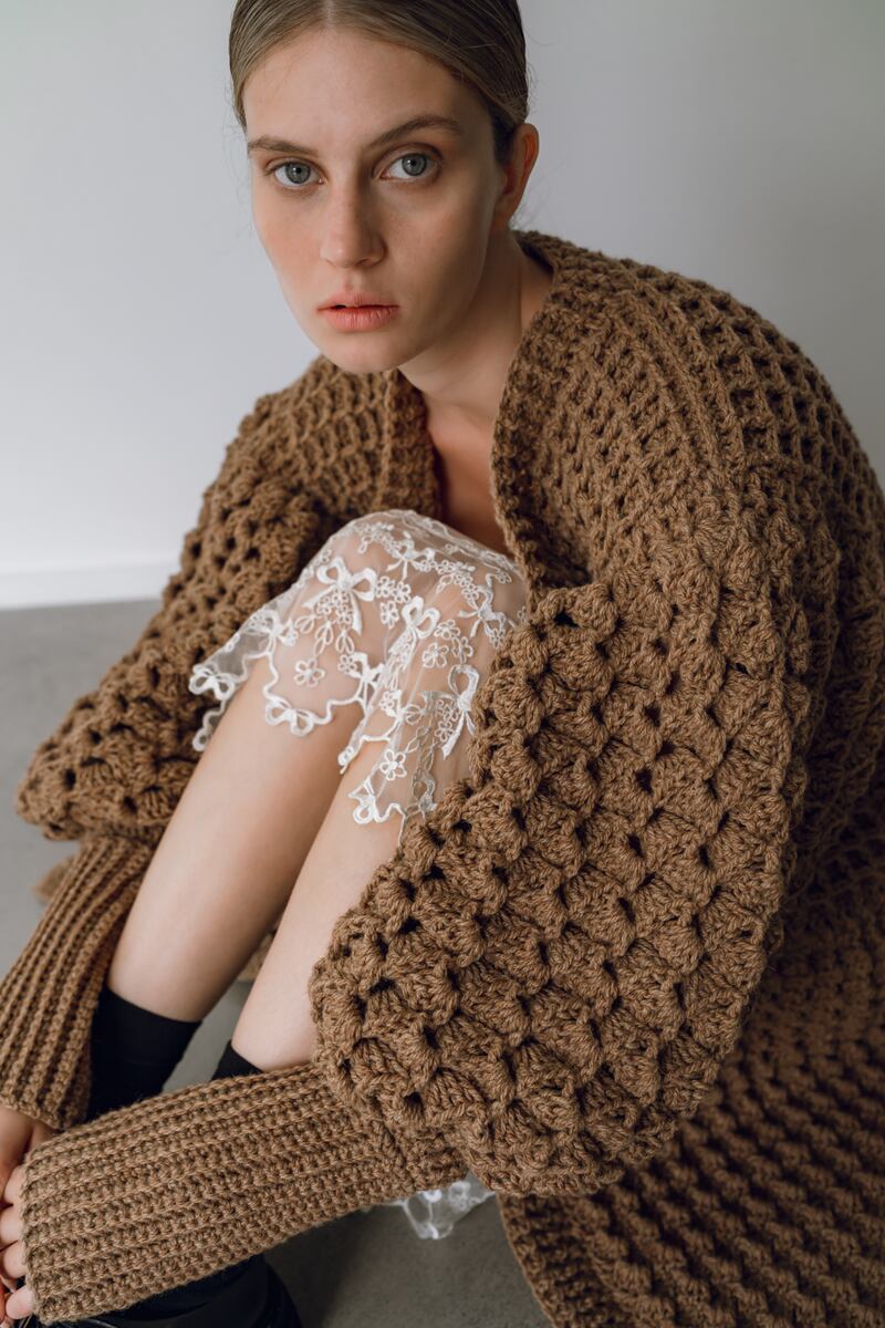 Handknit Aran crochet cardigan in camel €1495, cream slip dress €455 and shoes €1005 both Simone Rocha at Havana boutique. Photographer: Tetyana Maryshko
