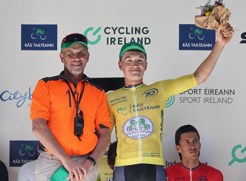 John O’Halloran presents the yellow jersey to race leader Odhran Doogan. Photograph: Lorraine O’Sullivan