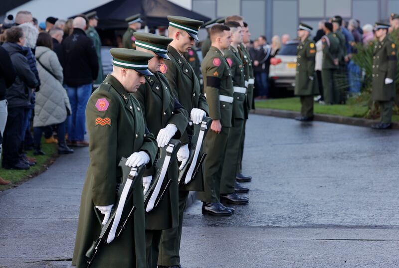 Members of the Defence Forces provide military honours at the funeral  at the Holy Family Church in Dundalk. Photograph: Alan Betson/The Irish Times

