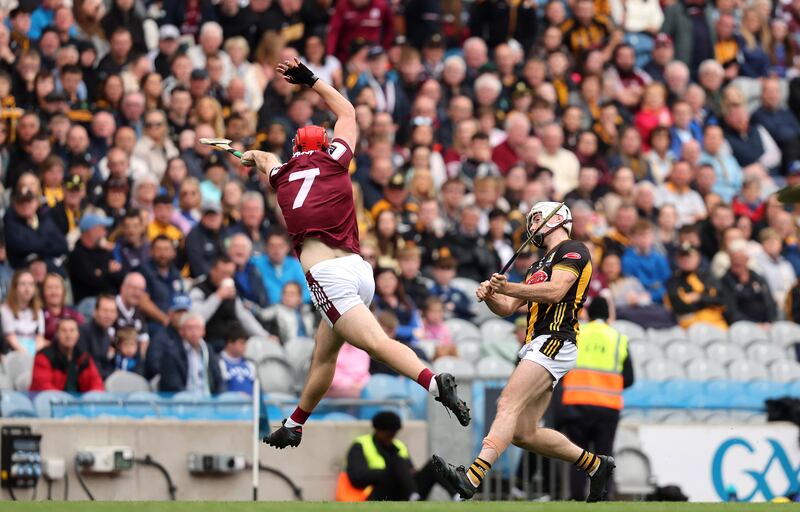 Galway's TJ Brennan attempts to block down Mikey Carey of Kilkenny. Photograph: Bryan Keane/Inpho