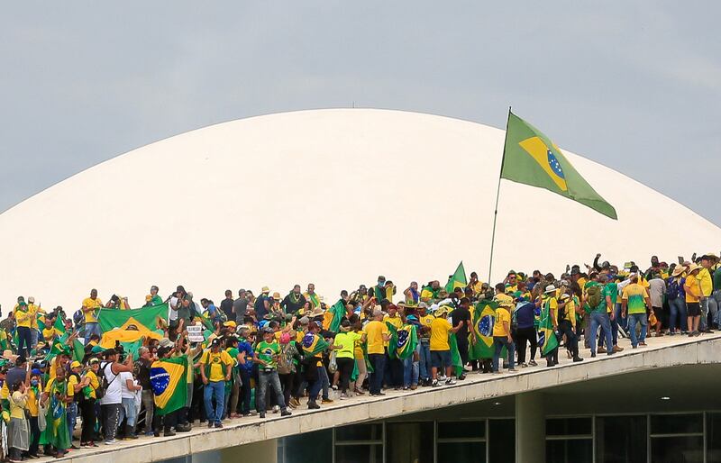 Supporters of Brazilian former president Jair Bolsonaro invade the National Congress in Brasilia on January 8th.  Responses to the attacks in Spain have highlighted political divisions there. Photograph: Sergio Lima/ Getty Images