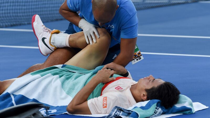 Novak Djokovic advanced after Kei Nishikori had to retire hurt. Photo: Greg Wood/Getty Images