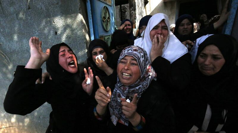 Relatives mourn the death of Hamad al-Nahal, a member of Islamic Jihad killed in an Israeli air strike on the Gaza Strip a day earlier, during his funeral in Rafah on Tuesday. Photograph: Said Khatib/AFP/Getty Images