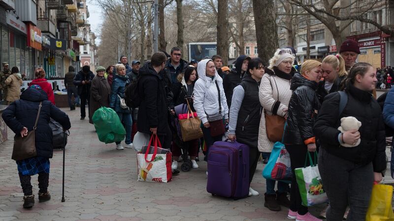 People wait in a line to get board an evacuation bus  Mykolaiv, eastern Ukraine, on Saturday, after it was targeted by  Russian attacks. Photograph:  Anastasia Vlasova/Getty Images
