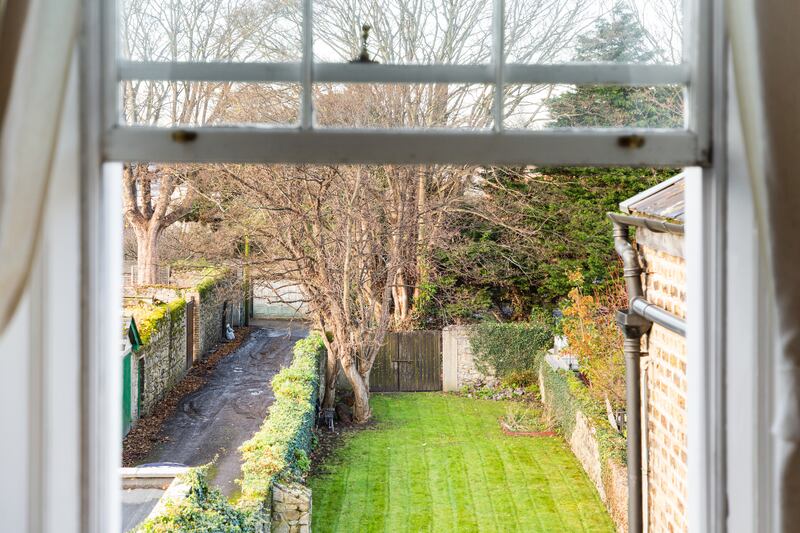 The rear garden runs parallel to a lane and extends to 145ft