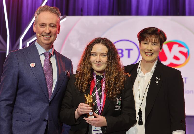 Philippa McIntosh, a runner up at the 60th Annual BT Young Scientist Exhibition, with BT Ireland managing director Shay Walsh and Minister for Education Norma Foley. Photograph: Alan Betson