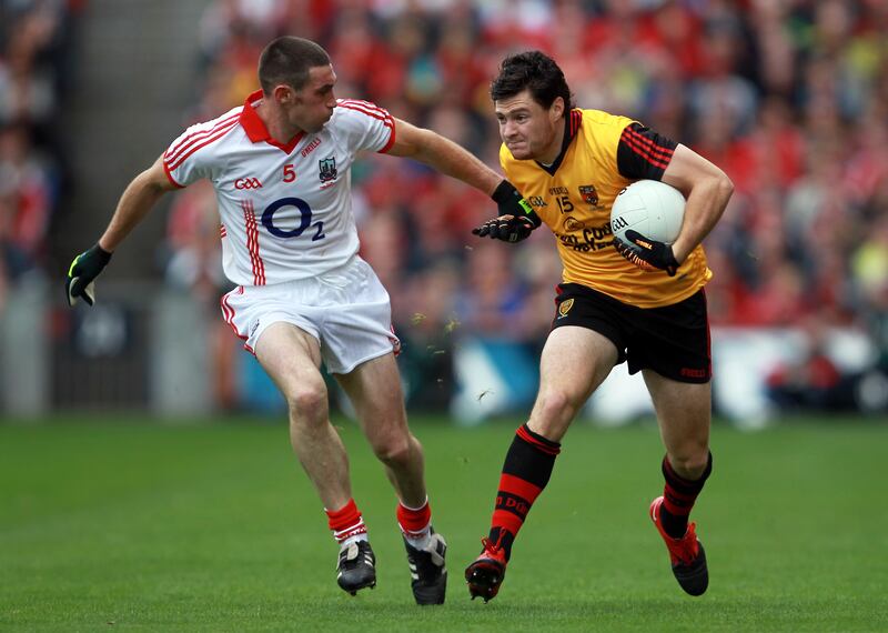 Noel O'Leary in action against Marty Clarke of Down in the 2010 All-Ireland final. Photograph: Donall Farmer/Inpho
