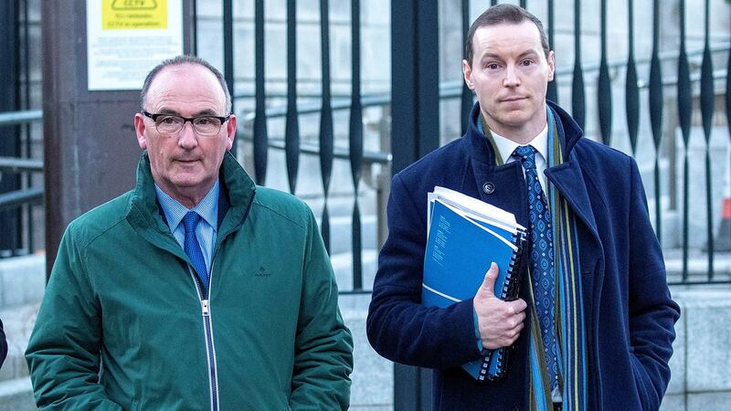 John Corcoran (63), of Nenagh, Co Tipperary, with his solicitor, Seán Fitzgerald leaving the High Court  after his case. Photograph: Collins Courts