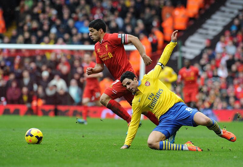Liverpool's Luis Suarez and Mikel Arteta of Arsenal during the league clash at Anfield in 2014. Liverpool won 5-1. 'You say: ‘I don’t know what’s going on, stop the game please, because I don’t know where I am. At Anfield you can concede five without knowing,' recalled Arteta. Photograph: Andrew Powell/Liverpool FC via Getty Images)