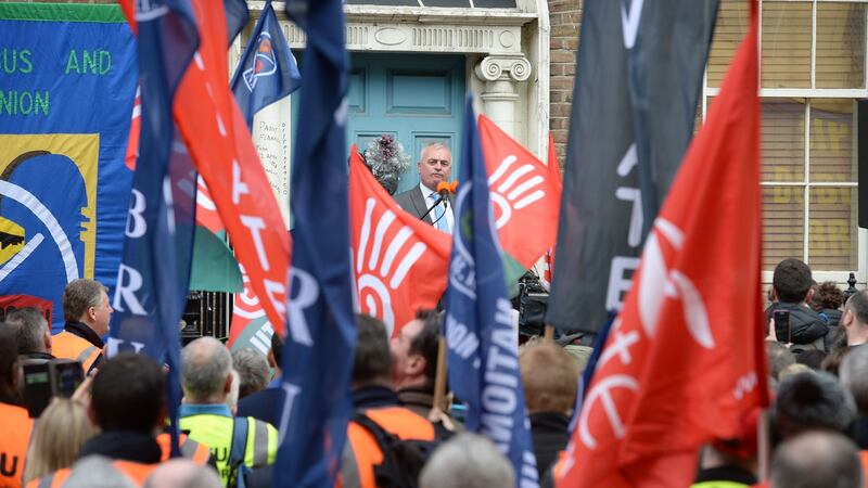 Bus Éireann dispute: striking drivers listen to Dermot O’Leary of the National Bus & Rail Union. Photograph: Dara Mac Dónaill