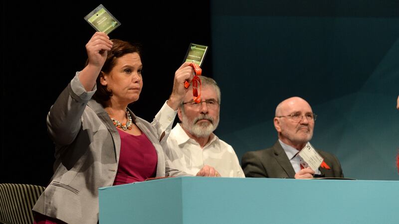 A file photograph of Sinn Féin’s Mary Lou McDonald, Gerry Adams and Alex Maskey (right) voting on a motion at the party’s ard fheis 2015. Photograph: Dara Mac Dónaill/The Irish Times.
