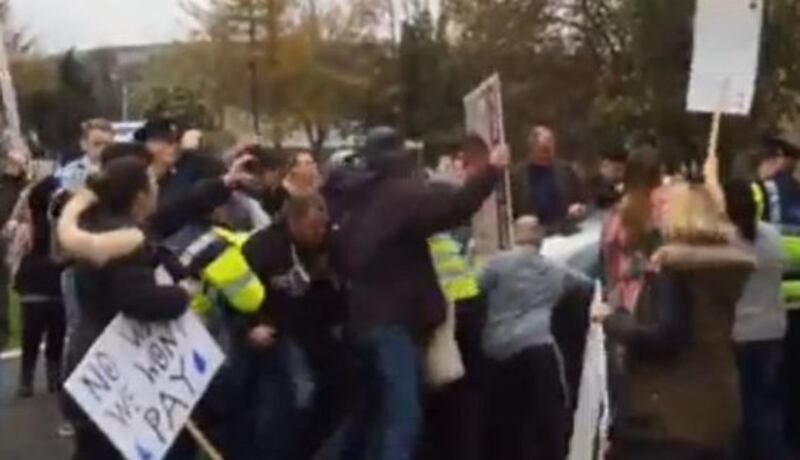 A screengrab from a video showing protests surrounding Tanaiste Joan Burton’s car in Tallaght on Saturday.