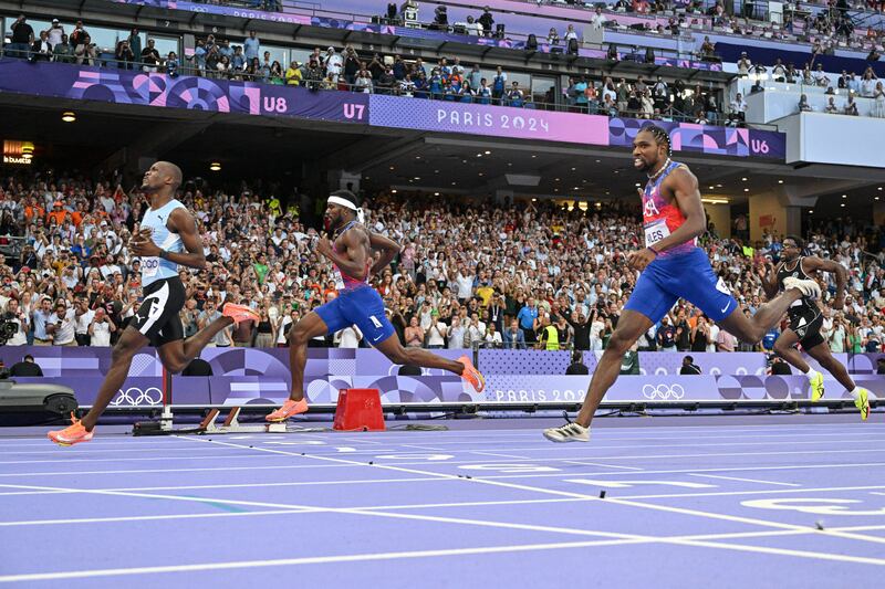 Botswana's Letsile Tebogo crosses the finish line ahead of USA's  Kenneth Bednarek and Erriyon Knighton in the men's 200m final in Paris.  Last March Knighton returned positive results for a banned substance. Photograph: Jewel Samad/AFP/Gettu Images 
