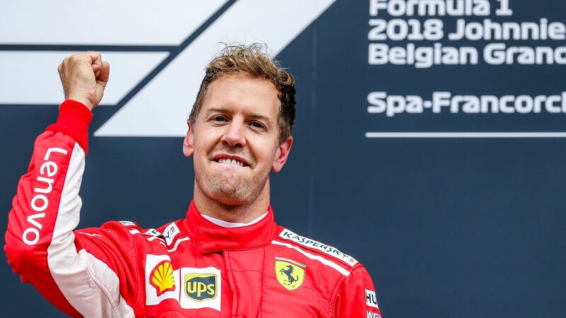 Sebastian Vettel of Scuderia Ferrari celebrates his win on the podium after the Belgium Formula One Grand Prix race. Photograph: EPA