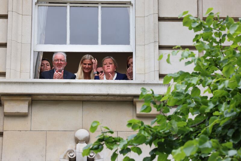 Green Party members look on as leader Eamon Ryan announces his resignation at Government Buildings. Photograph: Dara Mac Dónaill