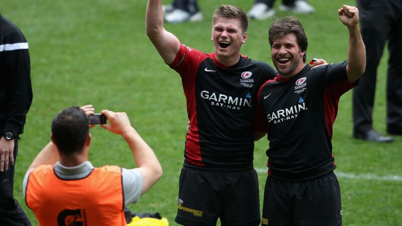 Andy Farrell takes a picture of son Owen and Schalk Brits after Saracens’ 2011 Premiership final win. Photograph: Scott Heavey/Getty