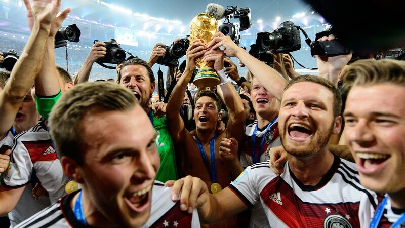 Mesut Özil  raises the World Cup trophy in 2014 with teammates Kevin Grosskreutz, Roman Weidenfeller, Shkodran Musta-fi and Erik Durm after the final victory over Argentina in Rio. Photograph:  Matthias Hangst/Getty Images