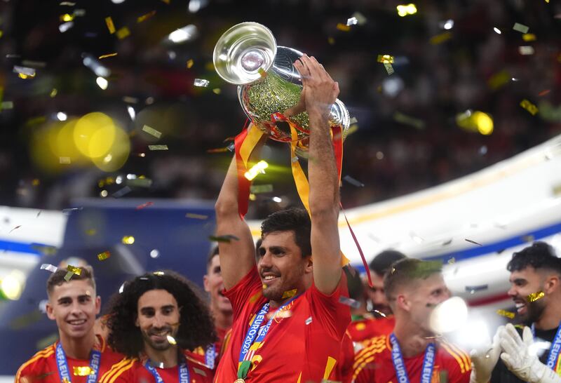 Spain's Rodri celebrating with the trophy after winning the Uefa Euro 2024 Final. Photograph: Adam Davy/PA