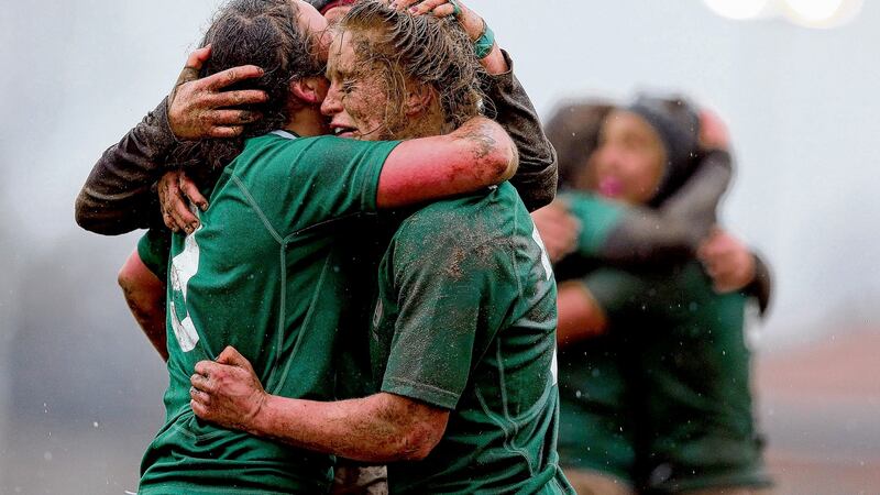 Ireland’s Claire Molloy, Larissa Muldoon and Joy Neville  celebrate the grand slam in 2013. A debacle in France the year before led to the IRFU  improving their support 100 per cent. Photograph: Dan Sheridan/Inpho