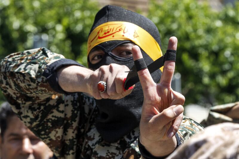 A member of Iran's Basij paramilitary forces aims a  sling during a rally marking al-Quds Day day in Tehran. Photograph: Getty