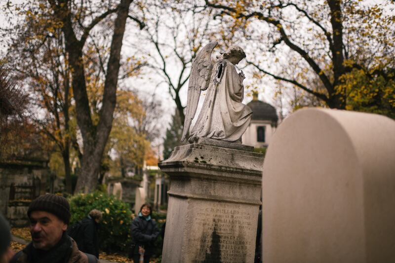 An angel statue, with a missing wing, at the Père-Lachaise cemetery. Birds are known to build nests inside the statue. Photograph: Dmitry Kostyukov/The New York Times