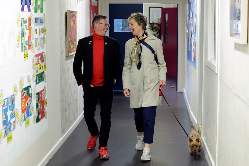 Ivana Bacik and her dog, Ginny, accompany party candidate Eddie McGuinness to a polling station in Dublin 8. Photograph: Conor Ó Mearáin / Collins Photo Agency
