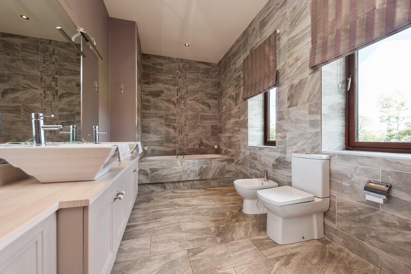 Main bedroom en suite with full-sized bath and his and her sinks