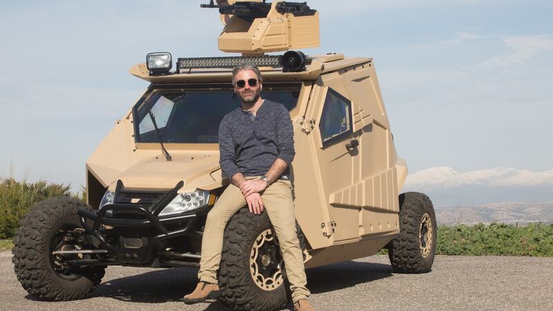 Designer Nir Kahn with one of Plasan’s military vehicles.
