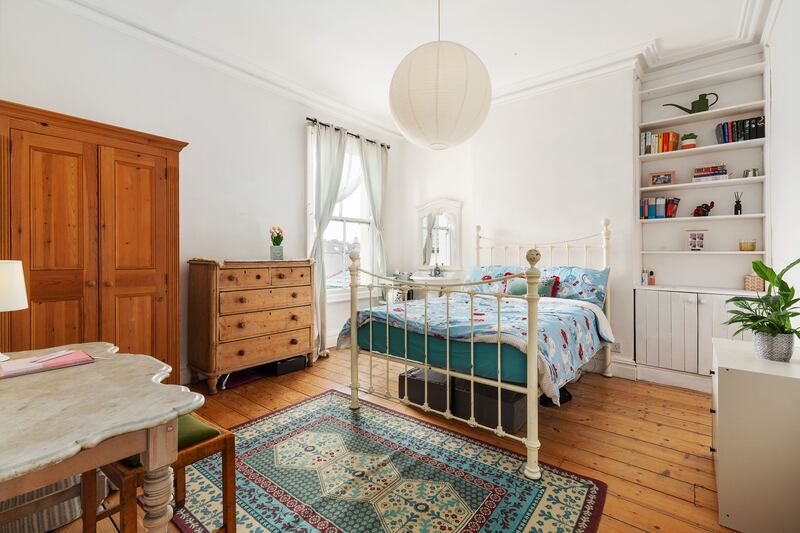 Bedroom with pitch pine floors.